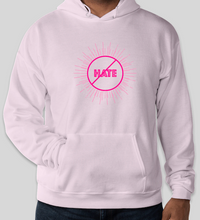 Load image into Gallery viewer, The conscious hoodie has arrived. There is no place for any type of hatred. This is all love.  The focus is peace, love and unity. Stay cool and cozy in our No Hate Gear Hoodie from the No Hate Gear Collection. This color is Pale Pink  with  Florescent Pink Letters. The No Hate Symbol is on the front with All Love on the back.  By Art of Love Apparel & Decor